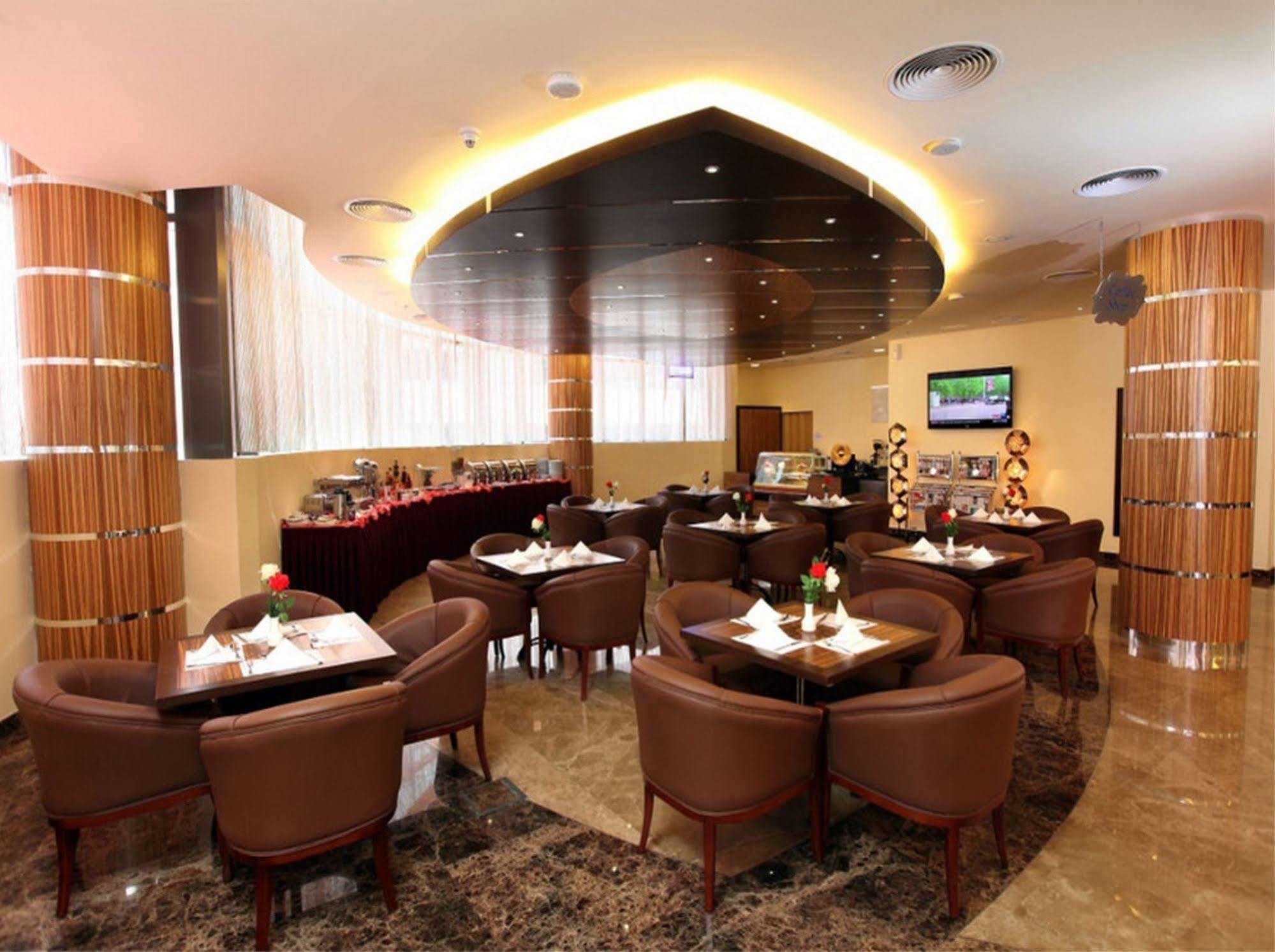 Xclusive Maples Hotel apartamento Dubái Restaurante foto